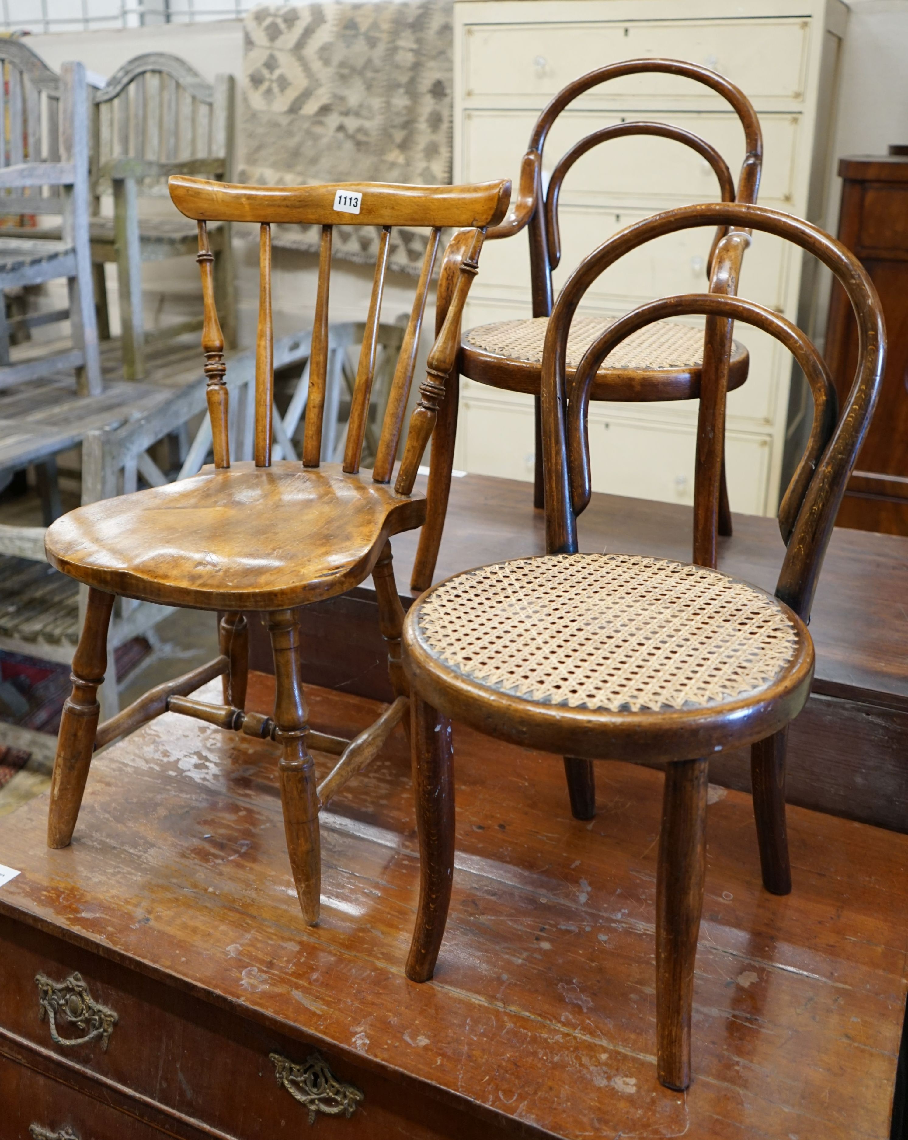 Two early 20th century childs' beach cane seat bentwood chairs and a child's Windsor chair